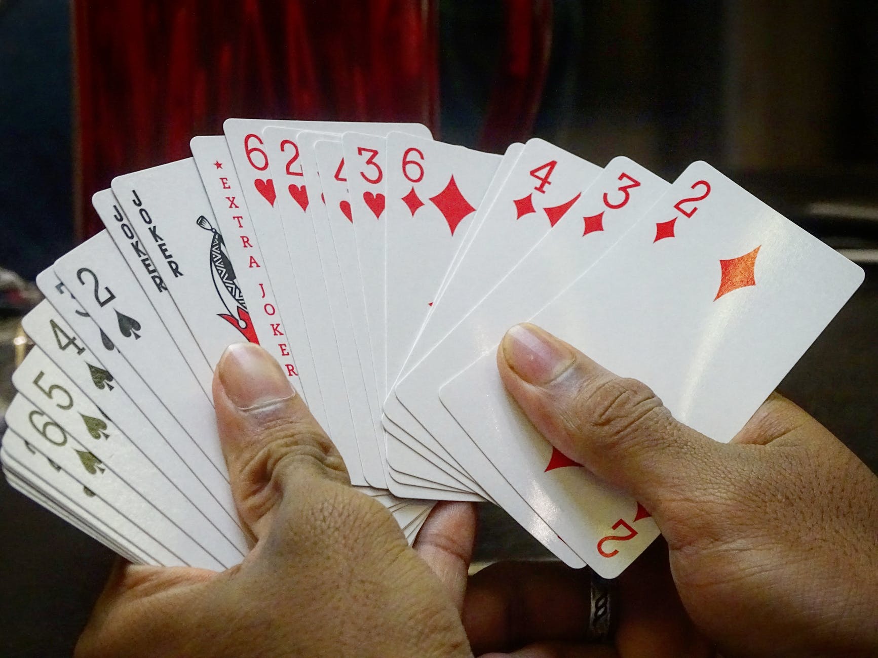 cards held by hands